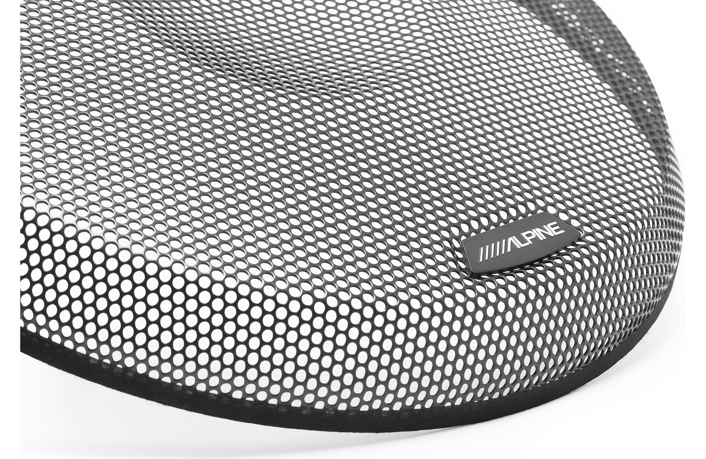 Close-up of a speaker with a honeycomb pattern