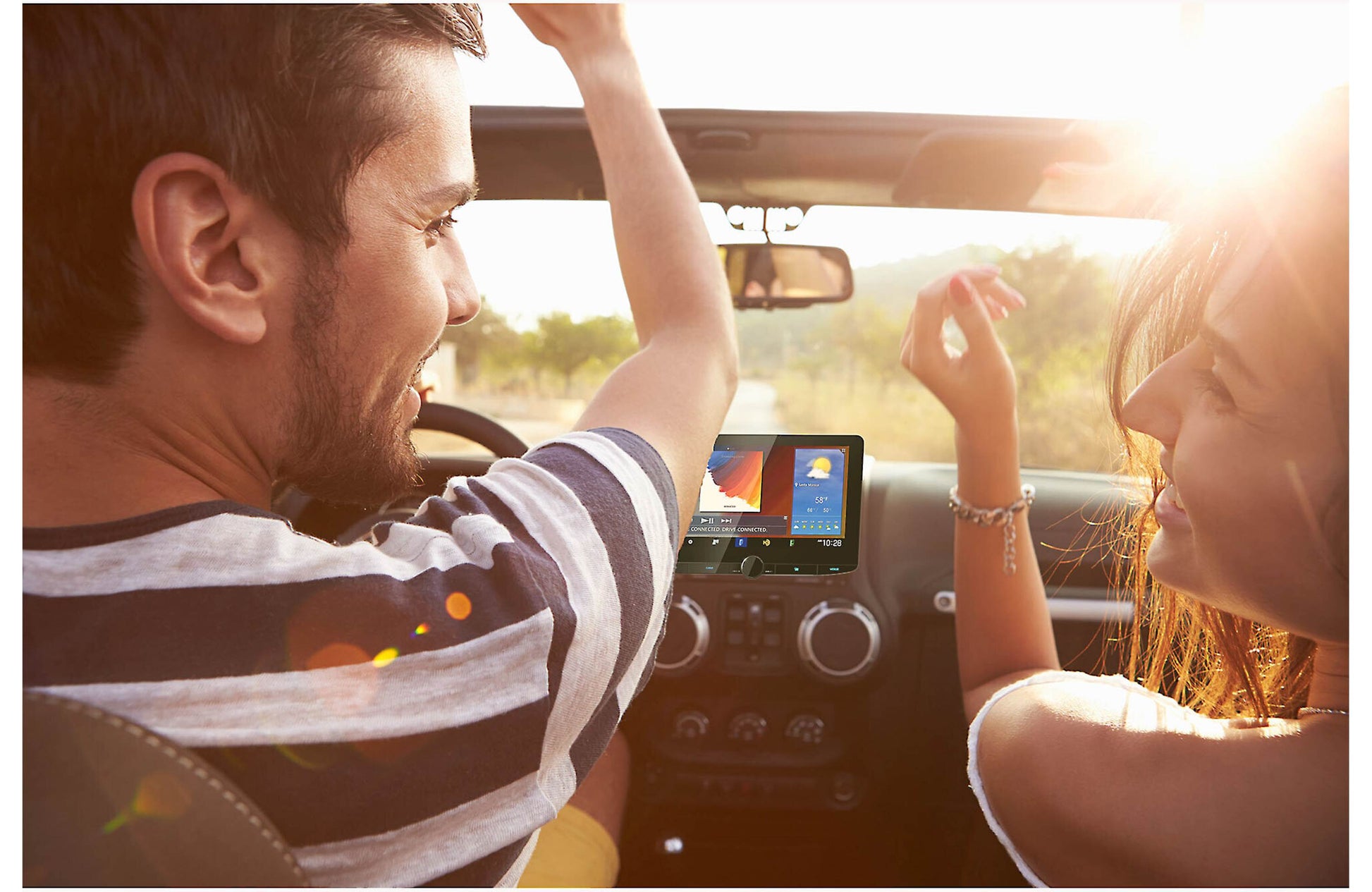 Two people in a car with a tablet