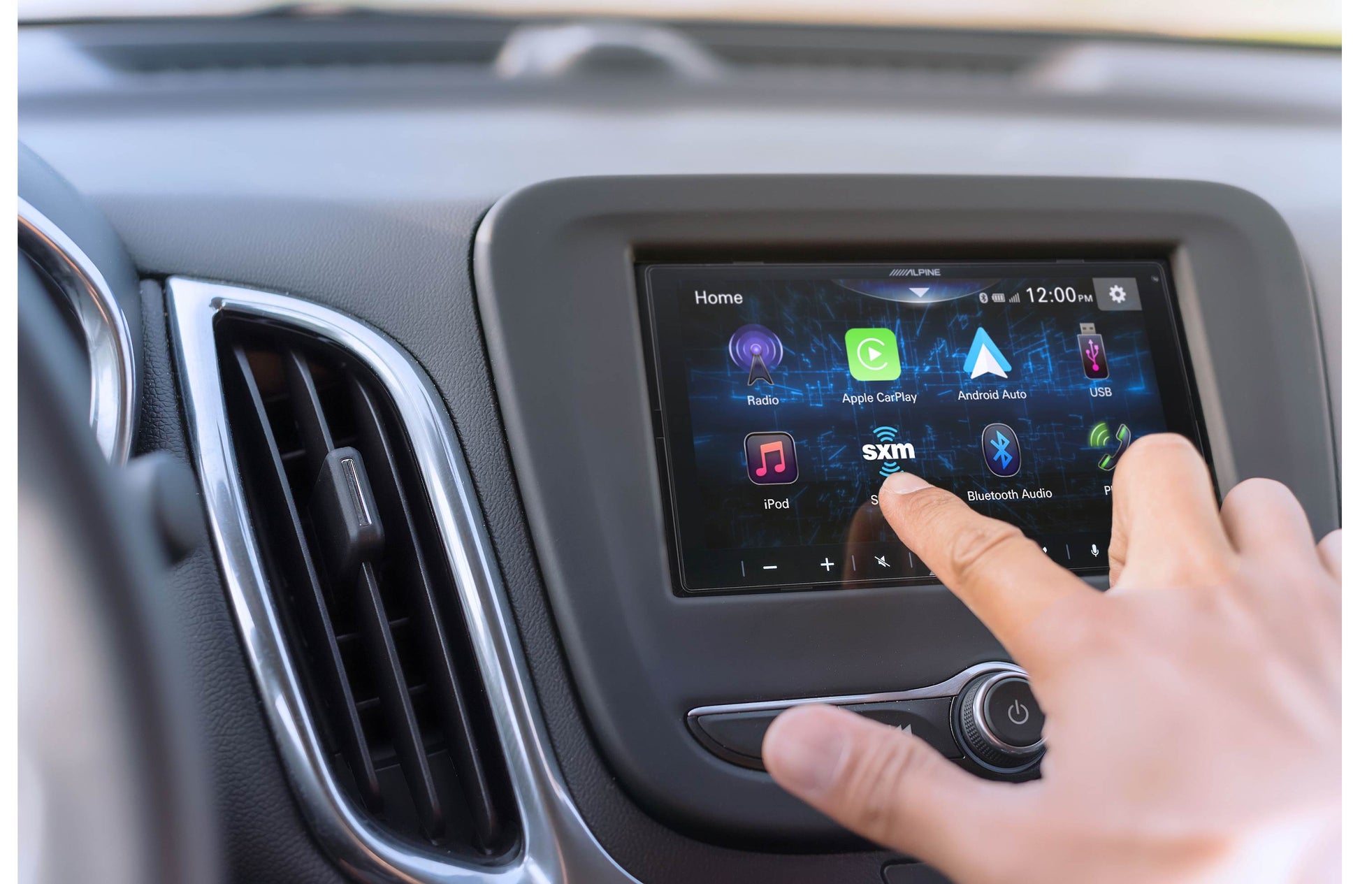 user-hand-operating-touchscreen-stereo