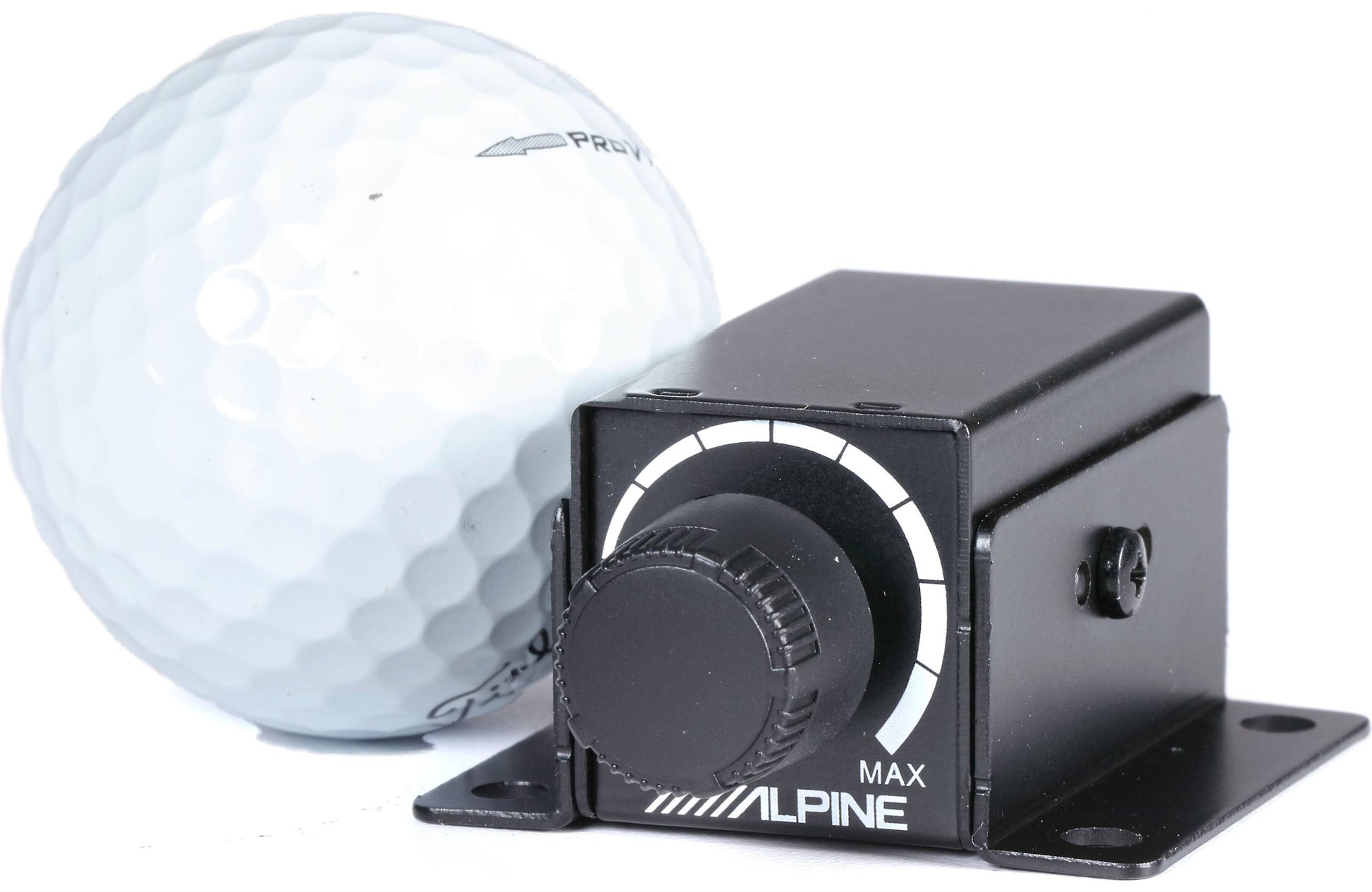 Golf ball next to a black Alpine device